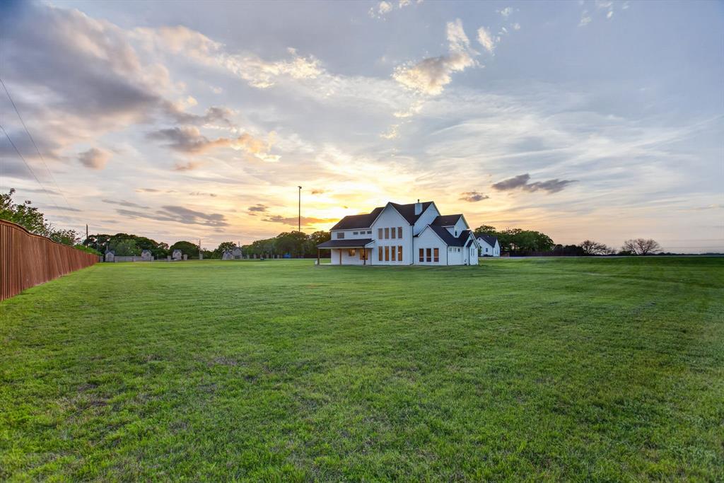 7798 Barber Rnch Road Fort Worth, TX 76126 - Photo 39 of 40 a view of a house with a big yard and large trees