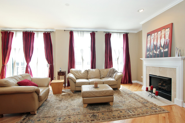 1638 South Indiana Avenue, Unit 4 Chicago, IL 60616 - Photo 2 of 14 a living room with furniture and a large window