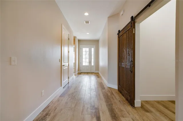 a bathroom with a granite countertop sink and a toilet