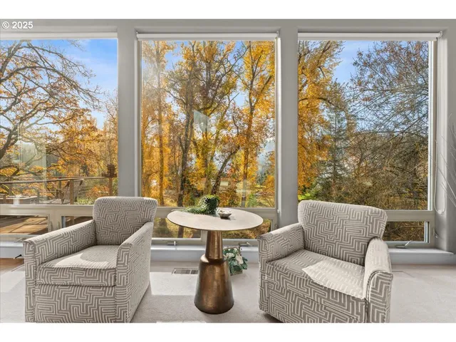 a view of a floor to ceiling window and wooden floor