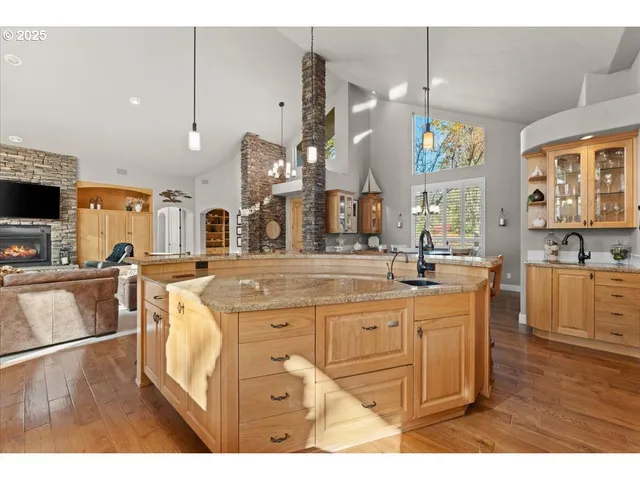 a kitchen with a sink and large window