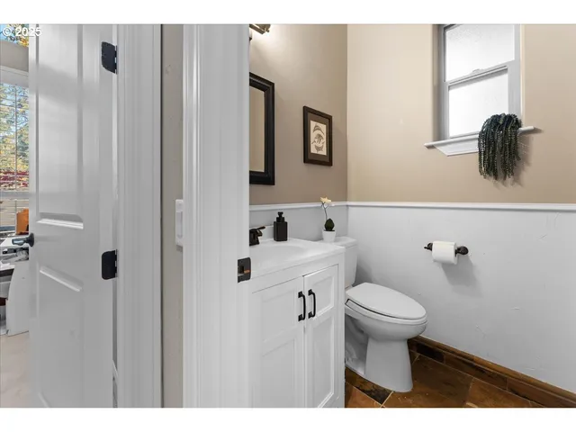 a bedroom with a bed and a desk