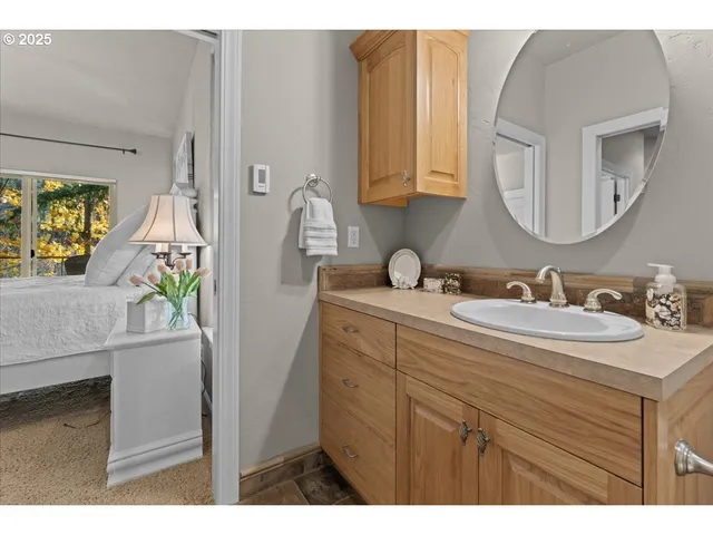 a kitchen with a sink cabinets and wooden floor