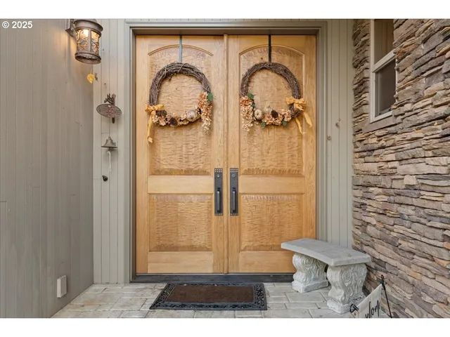 a view of a yard with wooden fence