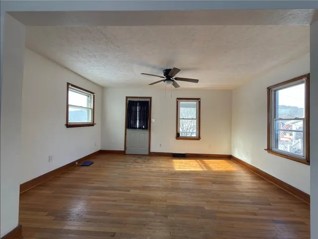 a view of an empty room with windows