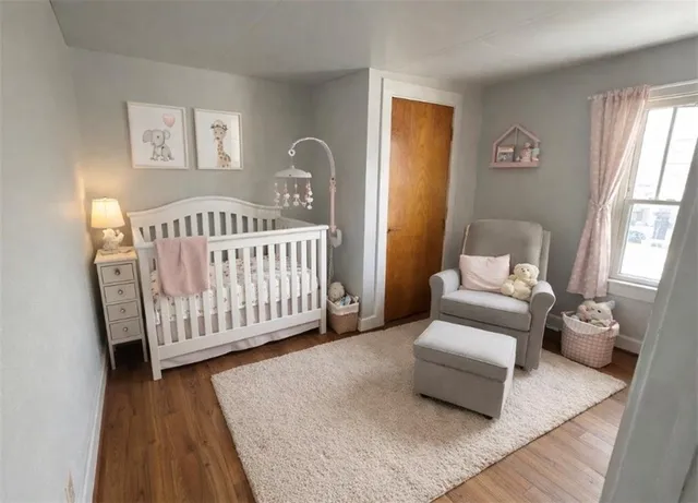 a bedroom with furniture and a window