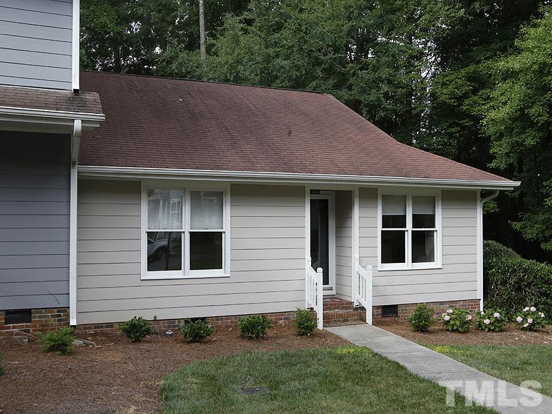 6400 Meadow View Drive Raleigh, NC 27609 - Photo 3 of 17 a front view of a house with a yard and outdoor seating