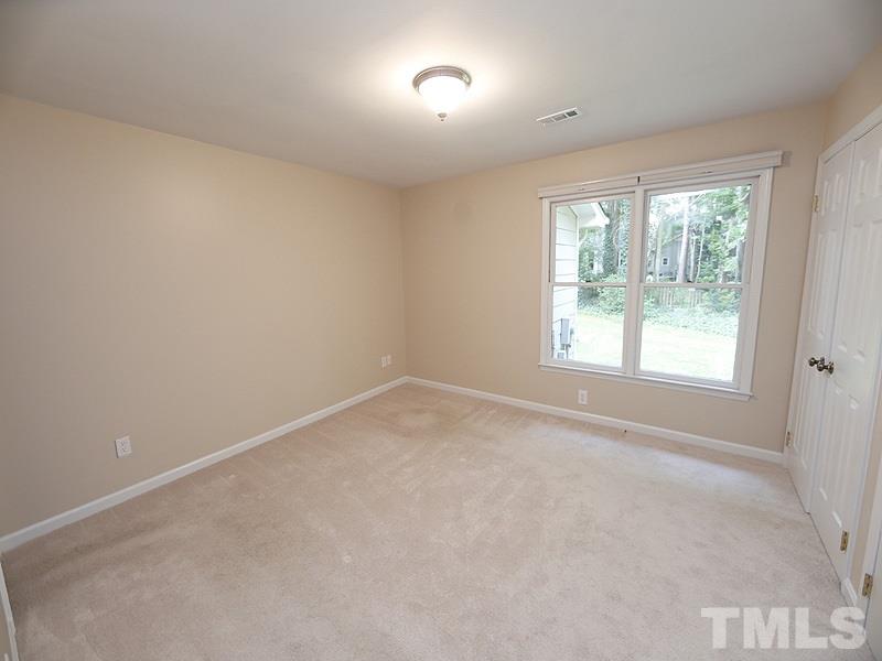 6400 Meadow View Drive Raleigh, NC 27609 - Photo 9 of 17 an empty room with a window