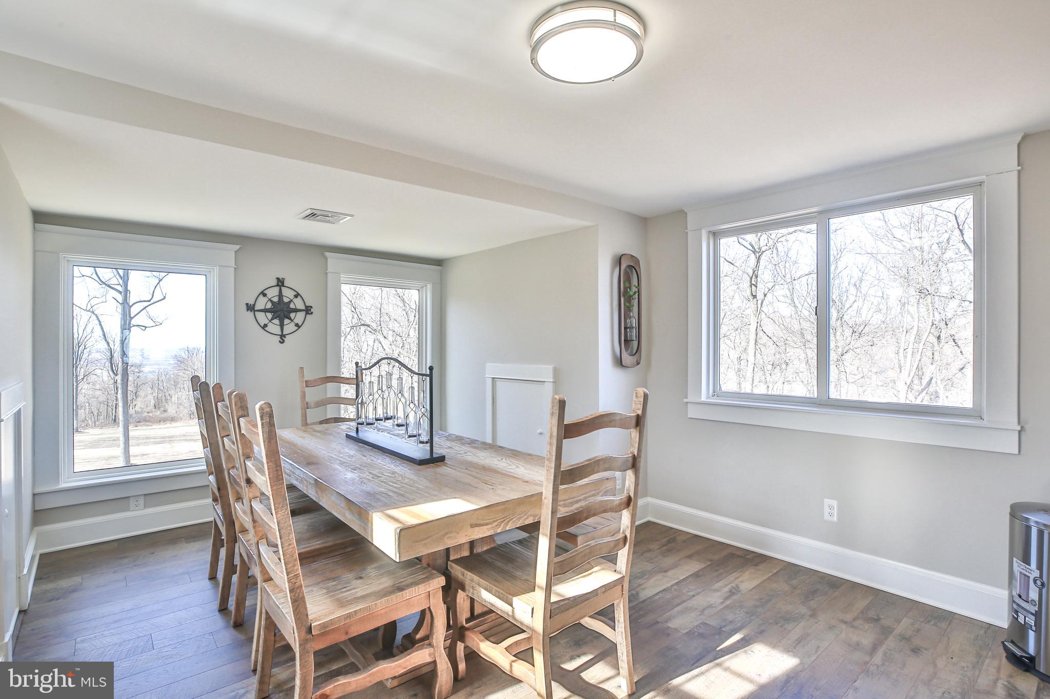 17345 Raven Rocks Road Bluemont, VA 20135 - Photo 80 of 99 a view of a dining room with furniture and wooden floor