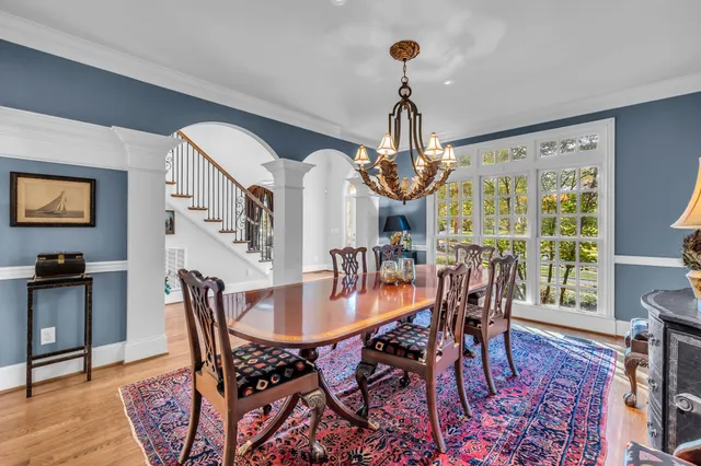 a living room with furniture and a view of kitchen