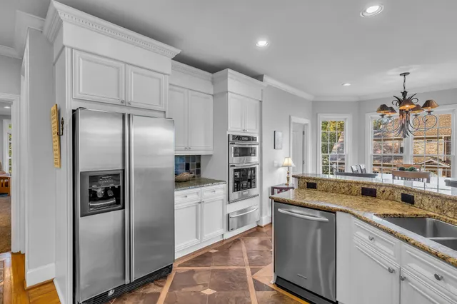 a large spacious bathroom with a granite countertop tub a mirror and a shower