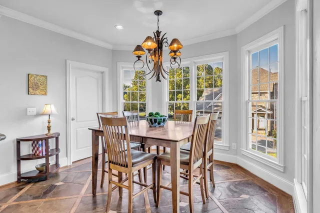 a bathroom with a granite countertop sink a mirror a bathtub and shower
