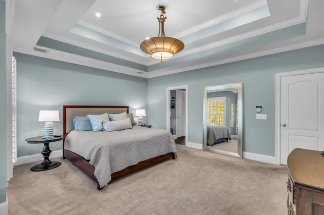 a bedroom with a bed and dresser