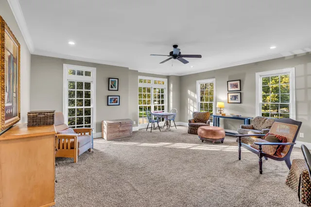 a bathroom with a sink a toilet a mirror a vanity a bathtub and shower