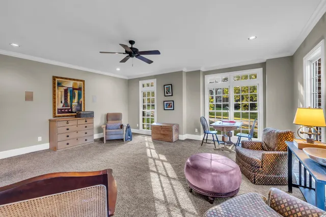 a bedroom with furniture and a book shelf