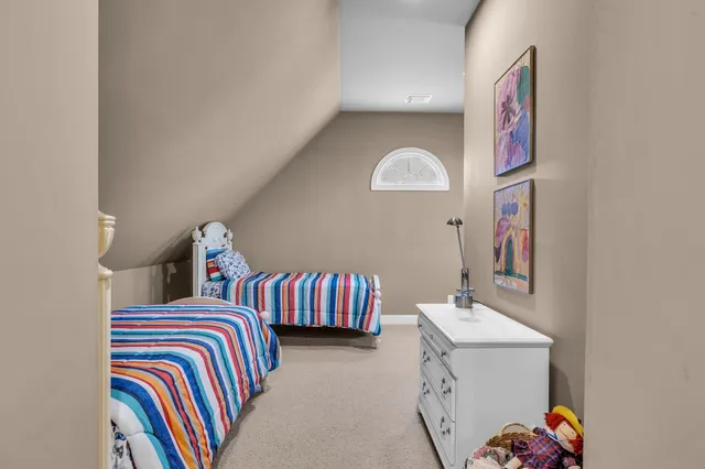 a living room with furniture a rug and a window