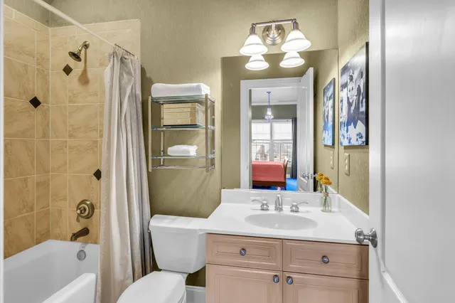 a aerial view of a house with table and chairs and a fire pit