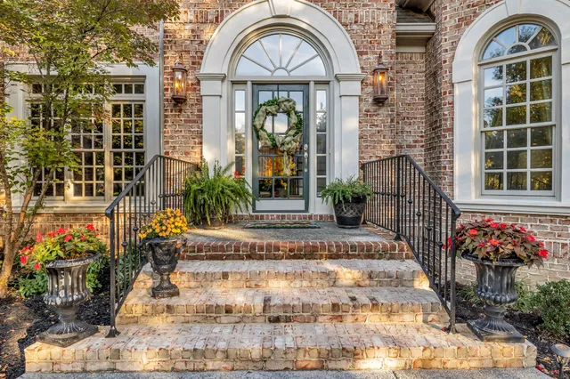 a picture of a living room with a chandelier