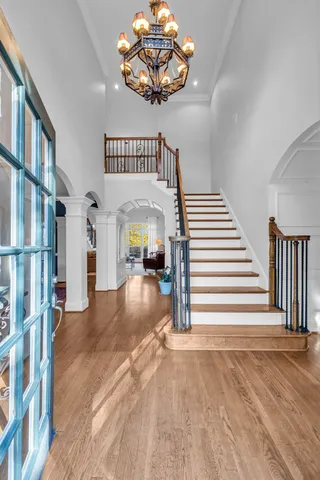 a view of an entryway with wooden floor and door