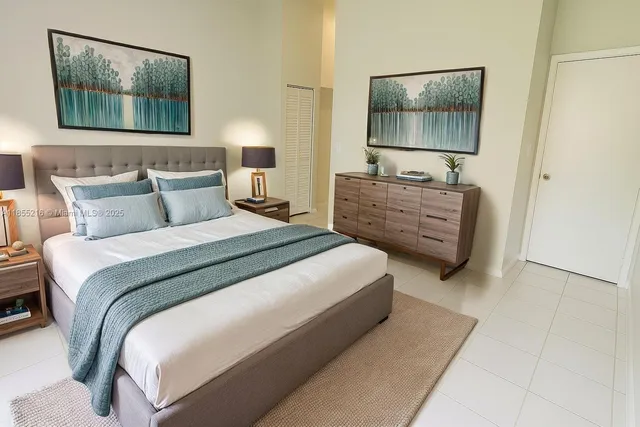 a bedroom with a bed and walk in closet