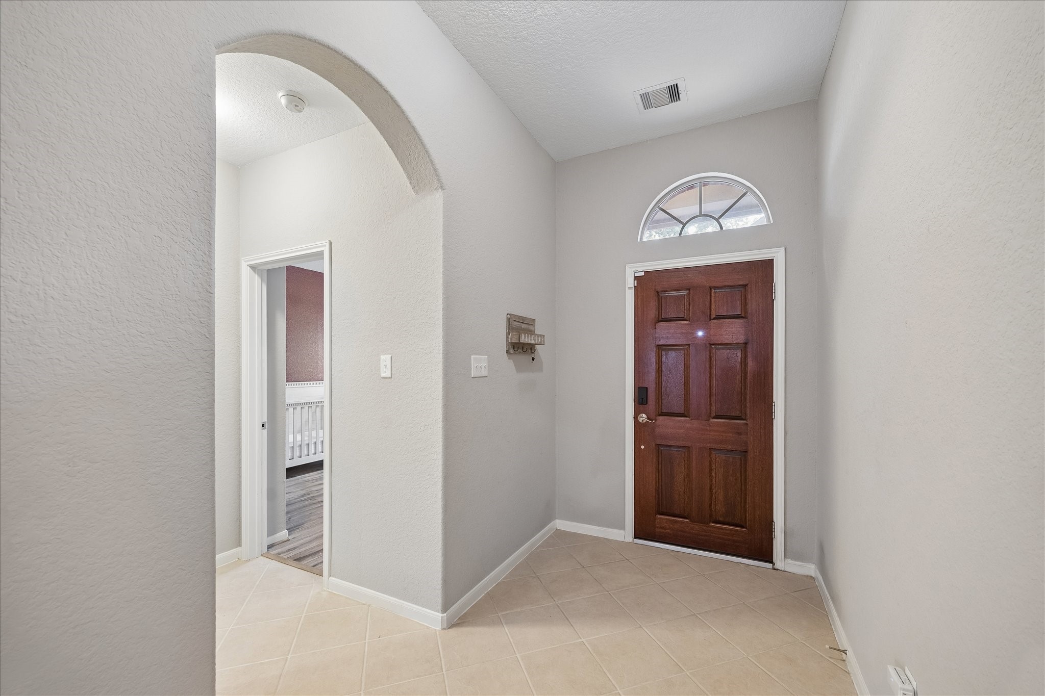 13006 Millstream Bend Lane Tomball, TX 77377 - Photo 2 of 25 an empty room with closet and wooden door