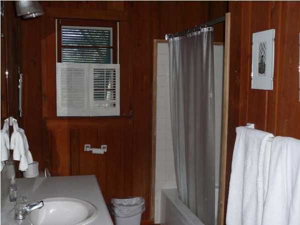 58 Garfield Street Santa Rosa Beach, FL 32459 - Photo 14 of 20 a bathroom with a sink a toilet a mirror and shower curtain