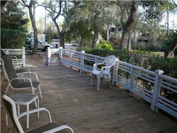 58 Garfield Street Santa Rosa Beach, FL 32459 - Photo 17 of 20 a view of a chairs and table in backyard