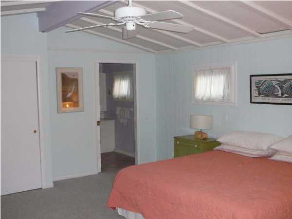 58 Garfield Street Santa Rosa Beach, FL 32459 - Photo 7 of 20 a bedroom with a bed and a chandelier