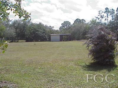 11630 Deal Road North Fort Myers, FL 33917 - Photo 2 of 9 a view of outdoor space and yard