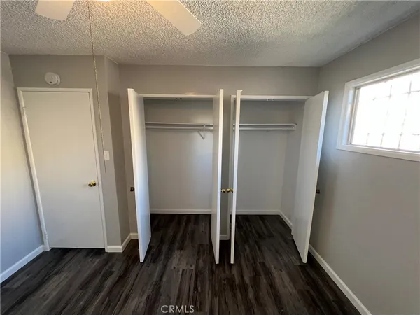 a spacious bathroom with a granite countertop sink and a mirror