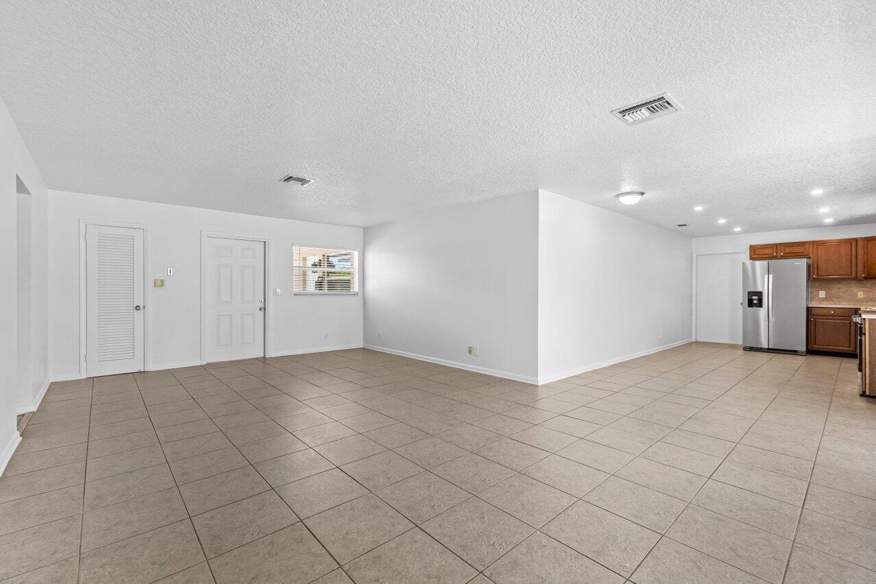 751 Hummingbird Way, Unit 7 North Palm Beach, FL 33408 - Photo 19 of 40 a view of an empty room