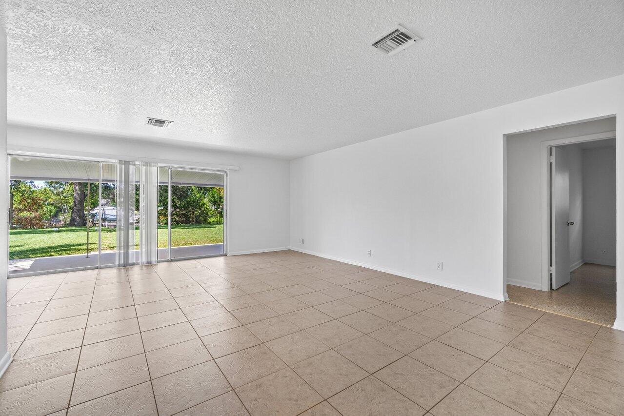 751 Hummingbird Way, Unit 7 North Palm Beach, FL 33408 - Photo 22 of 40 a view of an empty room and window