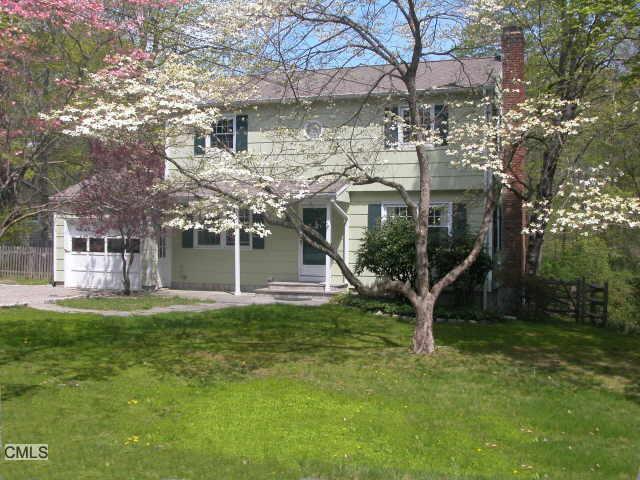 8 Mead Ridge Road Ridgefield, CT 06877 - Photo 1 of 1 a view of a house with a yard