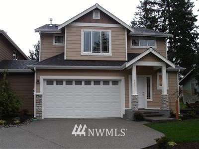 102 B 182nd Place Southwest Bothell, WA 98012 - Photo 1 of 1 a front view of a house with a garden