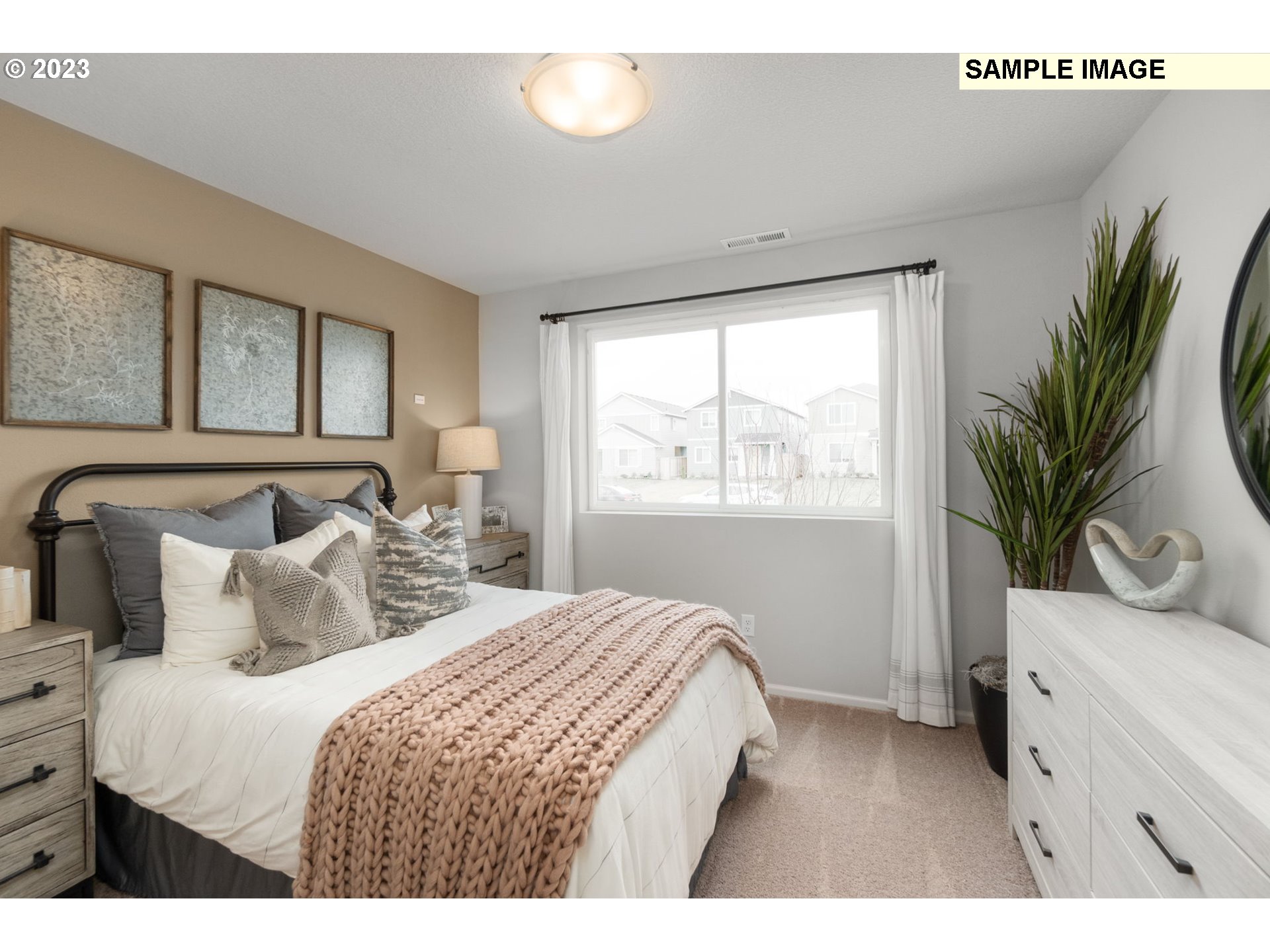 1058 Clemson Street Gervais, OR 97026 - Photo 13 of 20 a bedroom with a large bed and a window
