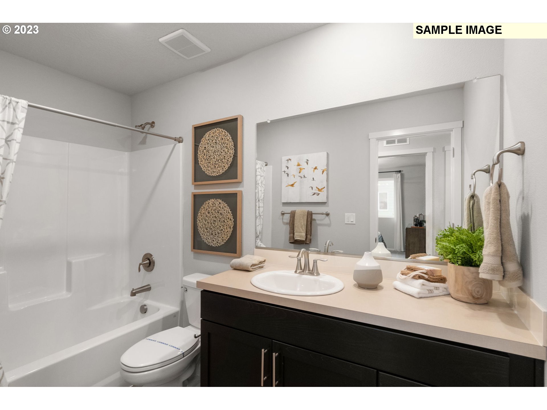 1058 Clemson Street Gervais, OR 97026 - Photo 16 of 20 a bathroom with a bathtub shower sink vanity and toilet