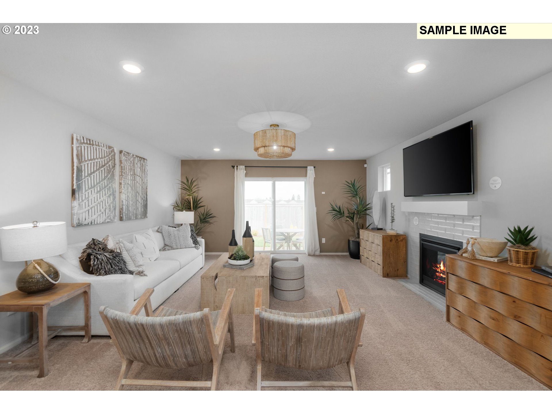 1058 Clemson Street Gervais, OR 97026 - Photo 19 of 20 a living room with furniture a fireplace and a flat screen tv