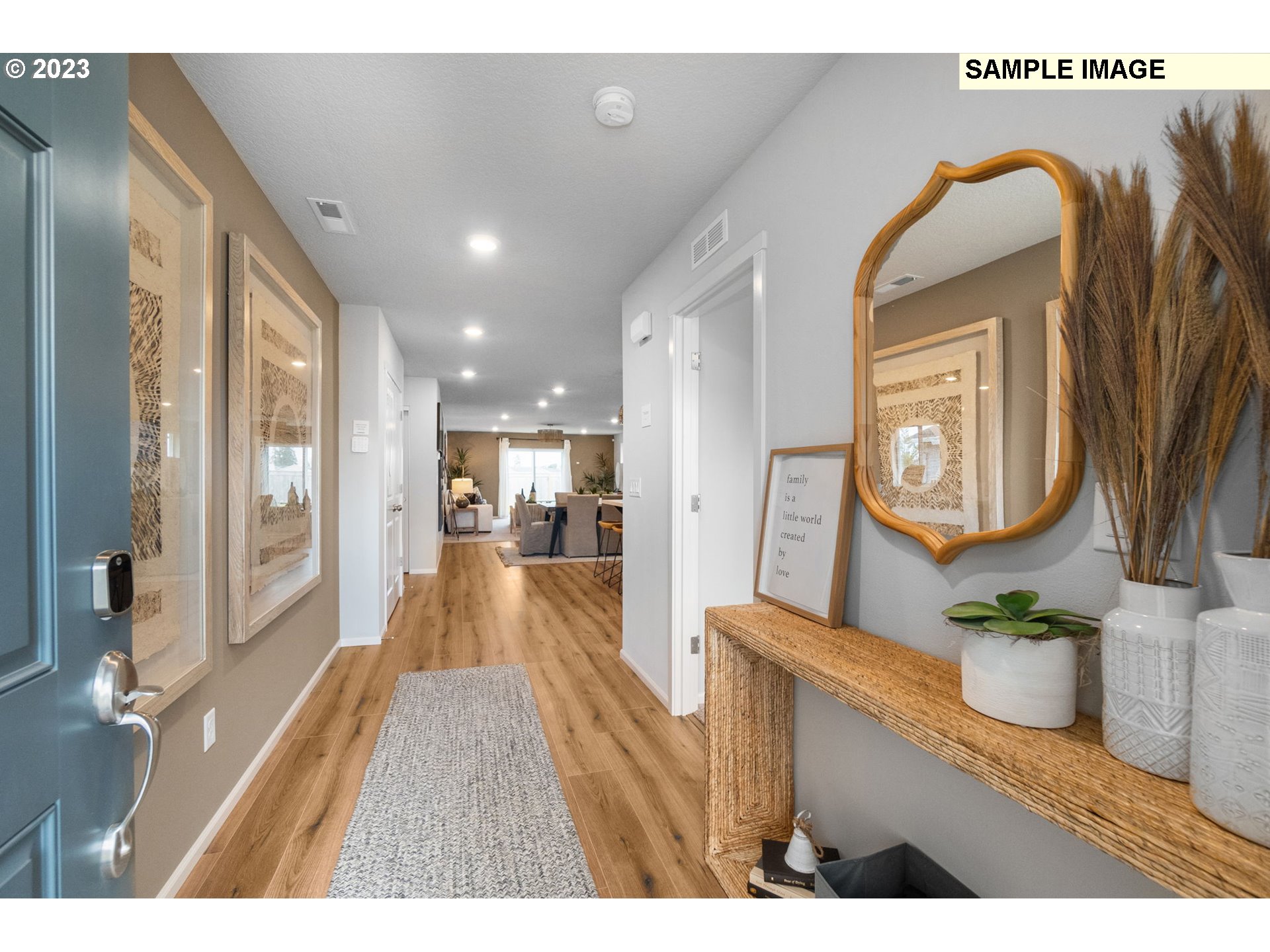1058 Clemson Street Gervais, OR 97026 - Photo 2 of 20 a view of a hallway with wooden floor