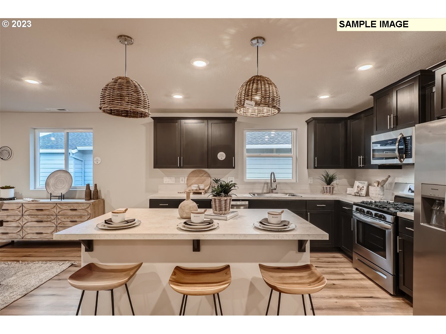 1058 Clemson Street Gervais, OR 97026 - Photo 4 of 20 a kitchen with stainless steel appliances kitchen island granite countertop a sink and cabinets