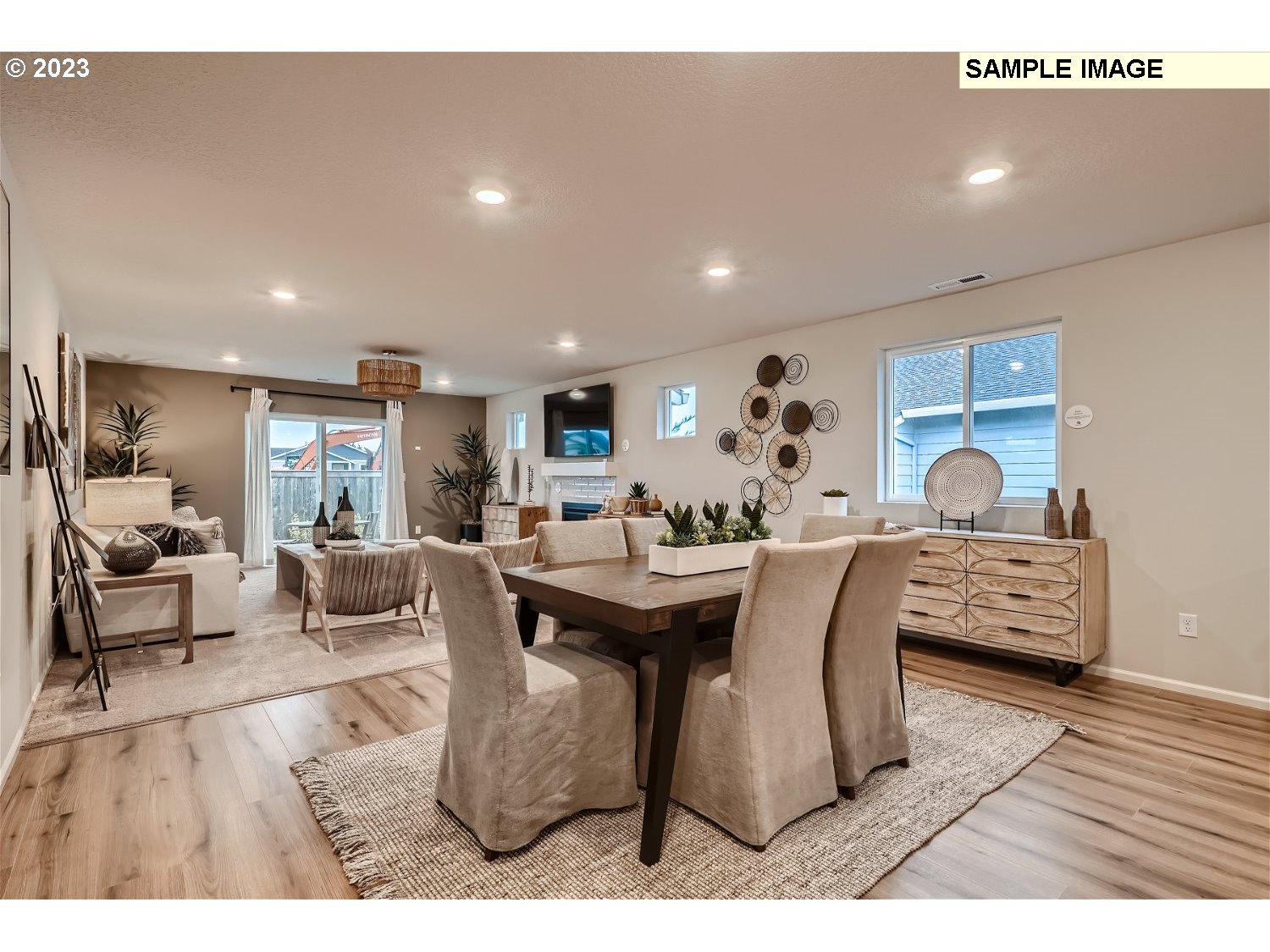 1058 Clemson Street Gervais, OR 97026 - Photo 5 of 20 a living room with furniture a wooden floor and a large window
