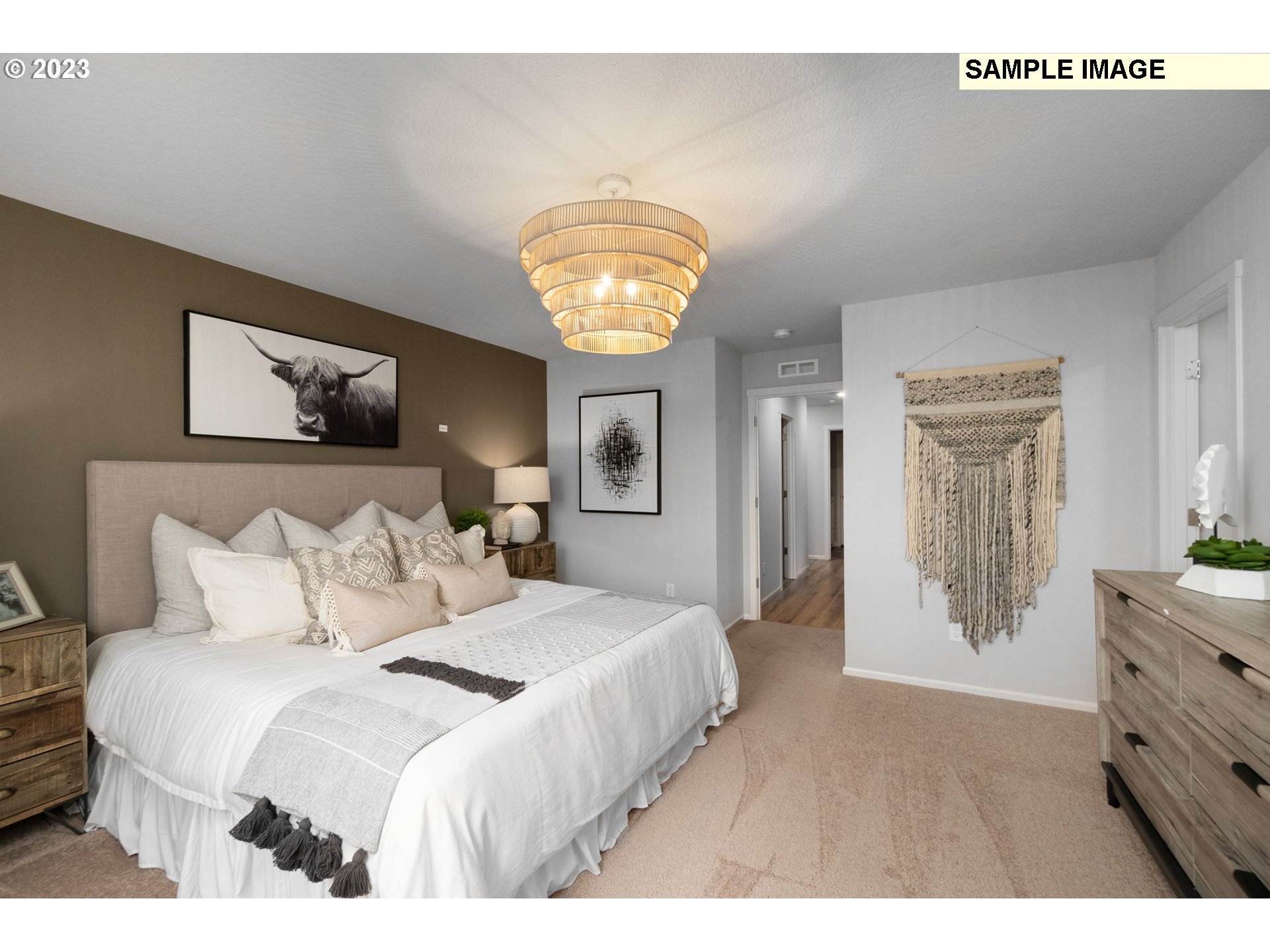 1058 Clemson Street Gervais, OR 97026 - Photo 6 of 20 a bedroom with a bed and a chandelier