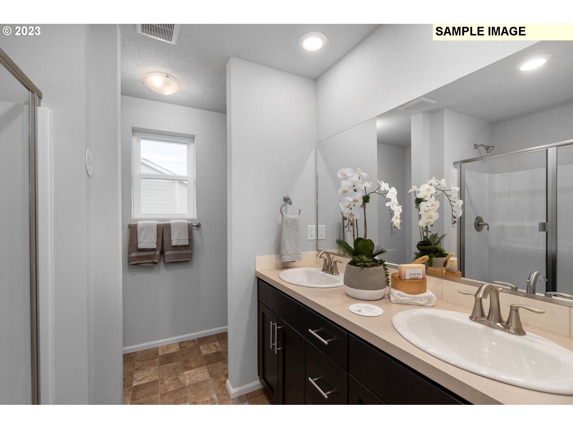 1058 Clemson Street Gervais, OR 97026 - Photo 10 of 20 a bathroom with a double vanity sink mirror and double