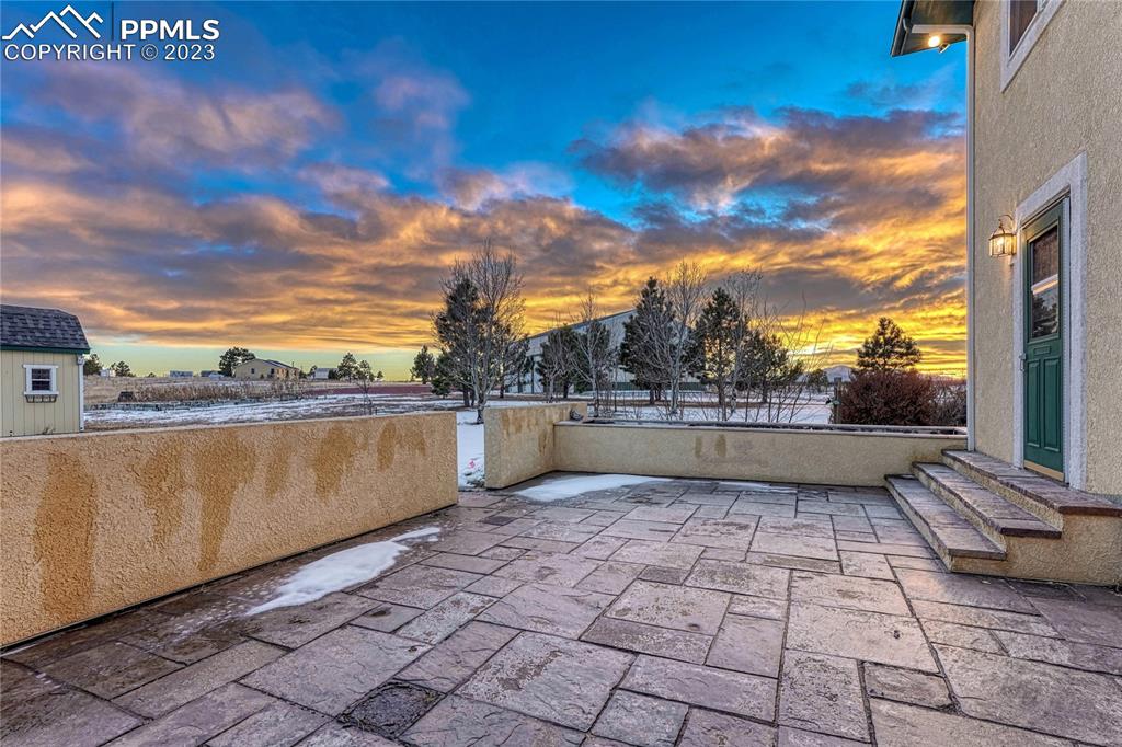12595 Mc Cune Road Black Forest, CO 80106 - Photo 6 of 44 Walkout from kitchen to large stone patio and mountain views!