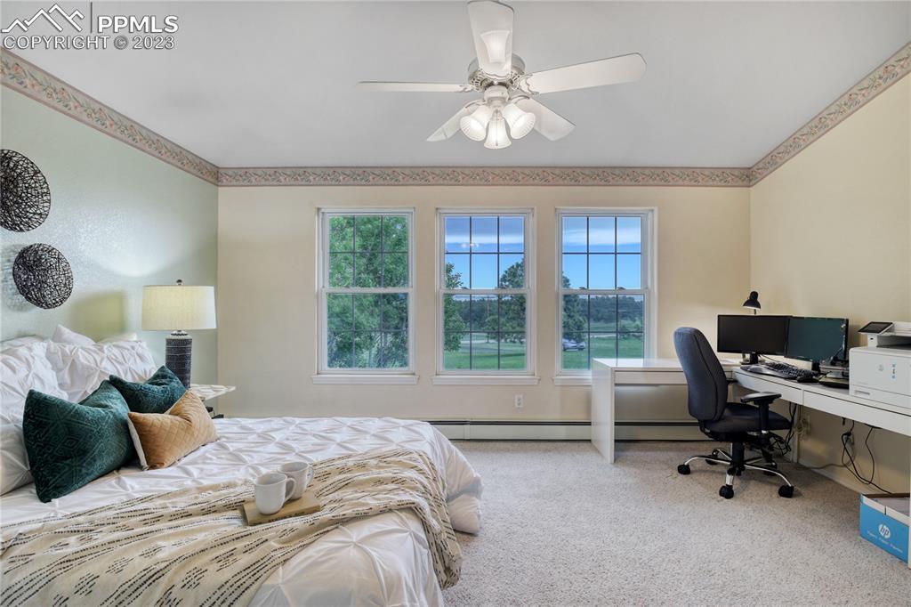 12595 Mc Cune Road Black Forest, CO 80106 - Photo 8 of 44 a bed room with a bed and a large window