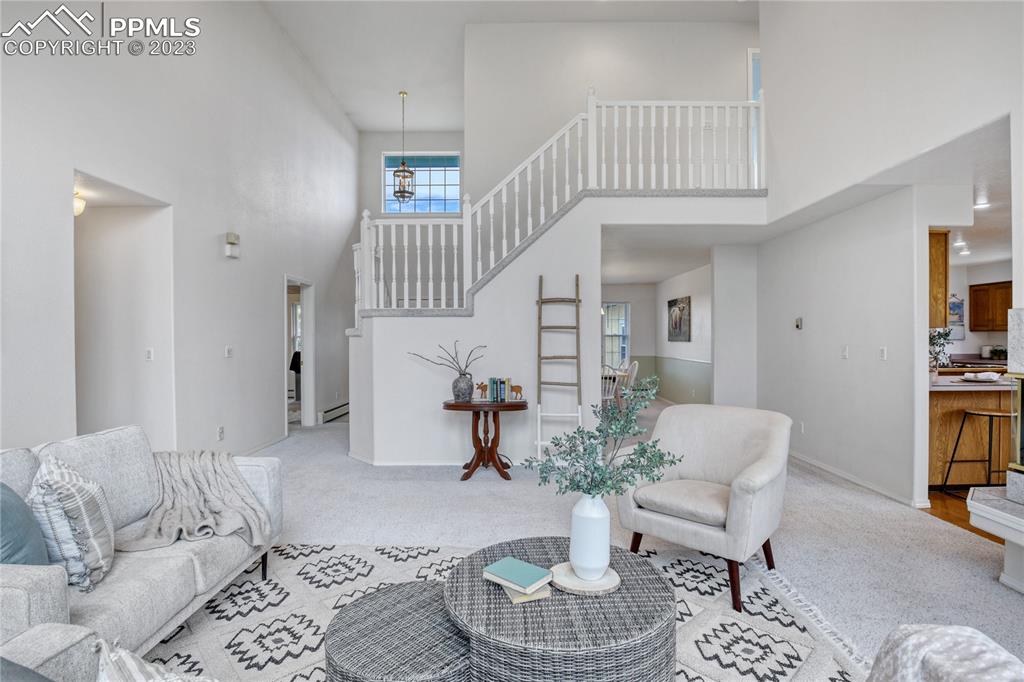 12595 Mc Cune Road Black Forest, CO 80106 - Photo 10 of 44 Living room leads to main hall, to master on the main and guest bath.