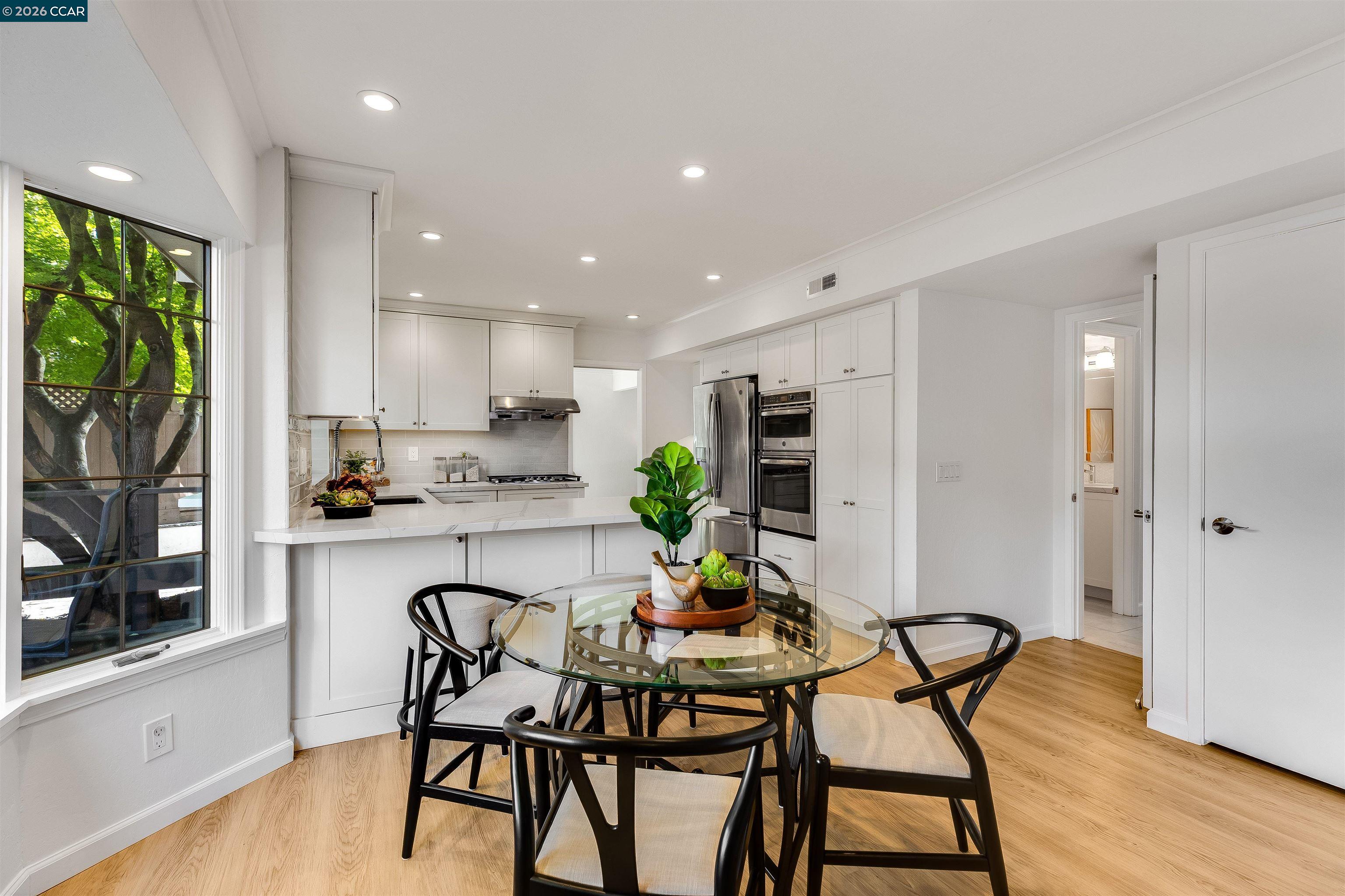 418 Devon Court San Ramon, CA 94583 - Photo 17 of 62 a kitchen with a table and chairs in it