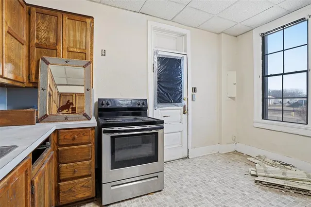 a view of a hallway with windows