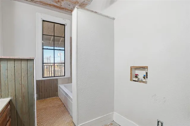 a bathroom with a sink a vanity and a mirror
