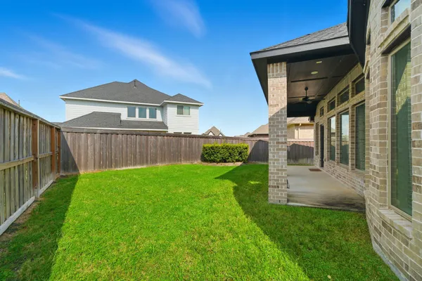 a front view of a house with a yard and porch