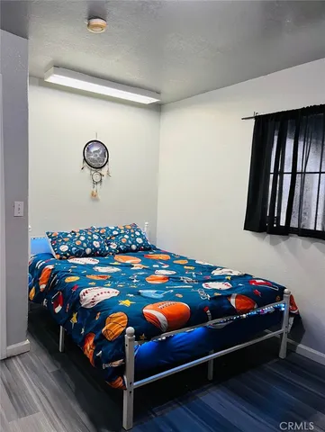 a bedroom with a bed and toys